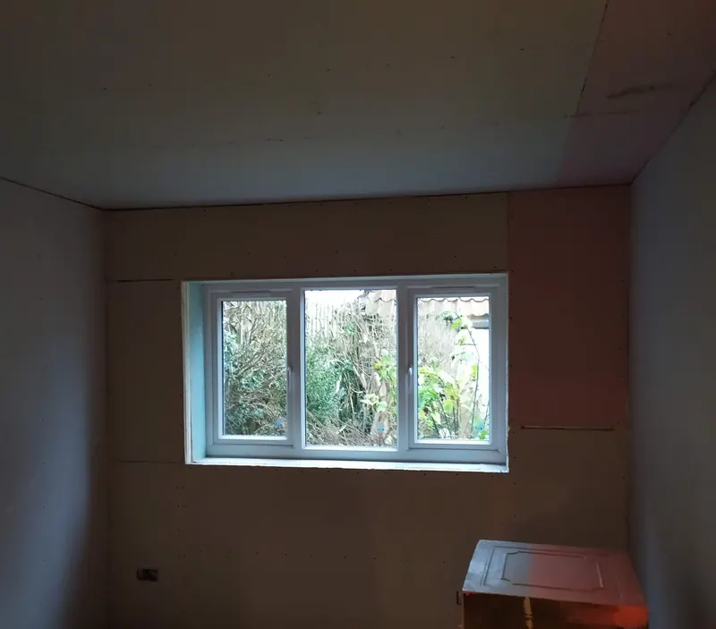 Converted garage insulated and plasterboarded with a new window