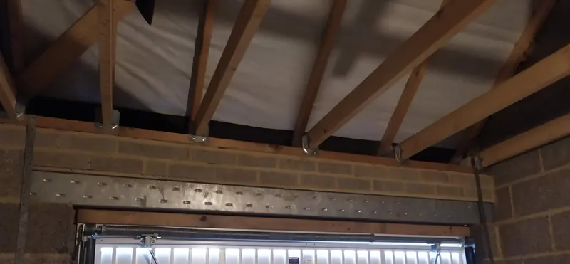 New steel lintel and ceiling joists above the garage door opening