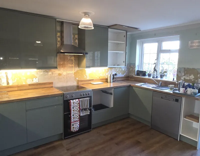New units, worktops and under-cabinet lighting fitted before tiling